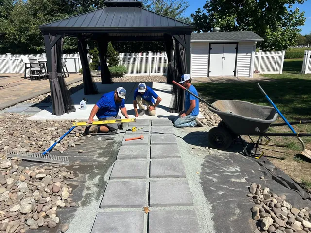Elzey Services crew installing a paver walkway and patio