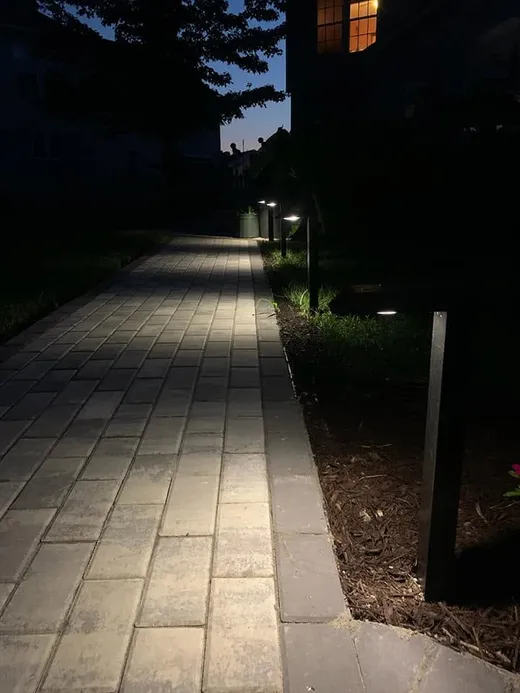 Path lighting along a paver walkway at night