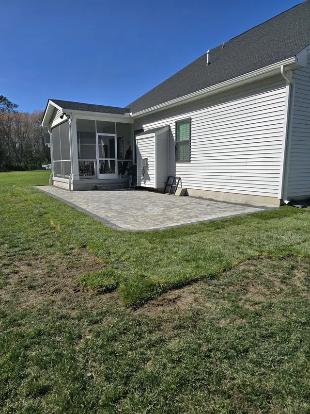Paver walkway alongside a retaining wall
