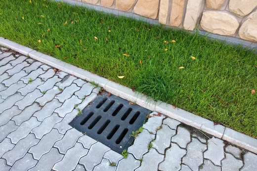Drain grate installed in a paver walkway